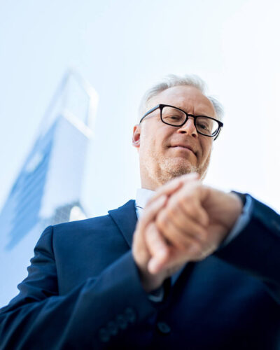 senior-businessman-checking-time-on-his-PGPN5MF(1)