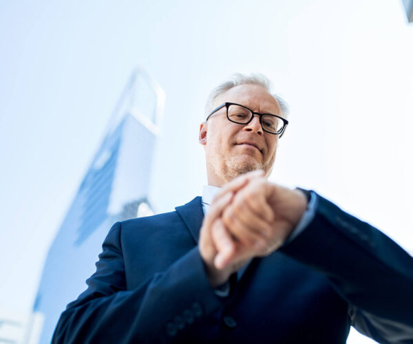 senior-businessman-checking-time-on-his-PGPN5MF(1)