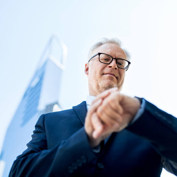 senior-businessman-checking-time-on-his-PGPN5MF(1)