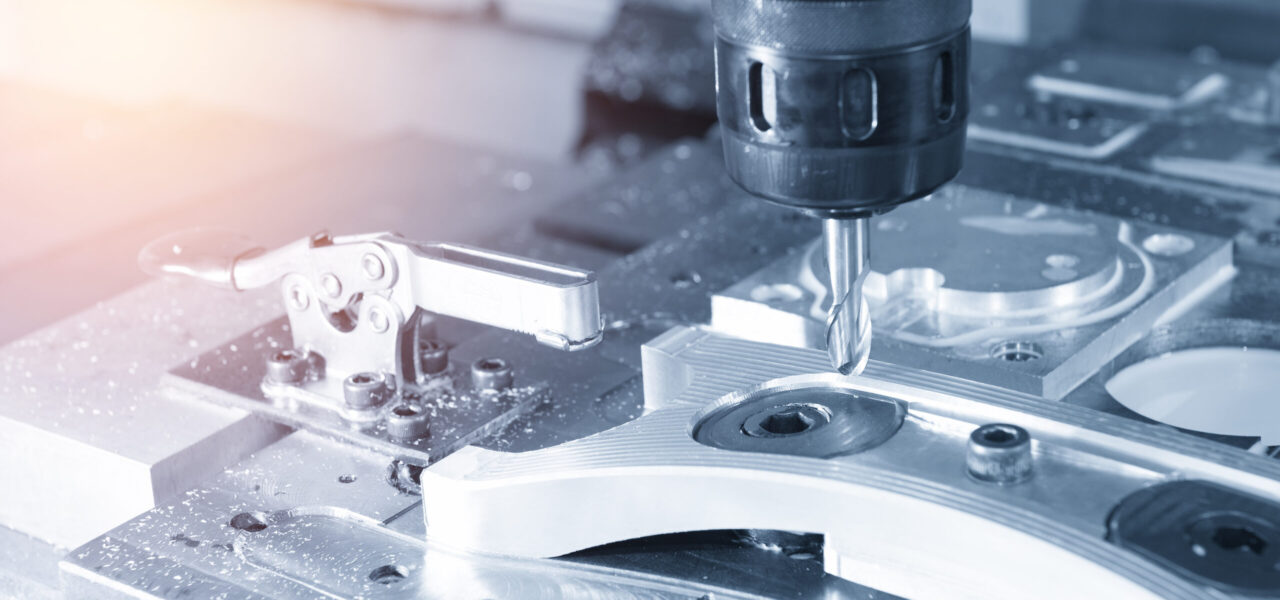 The CNC milling machine cutting the sample part with the cuttin The CNC milling machine cutting the sample part with the cutting tool in light blue scene and lighting effect